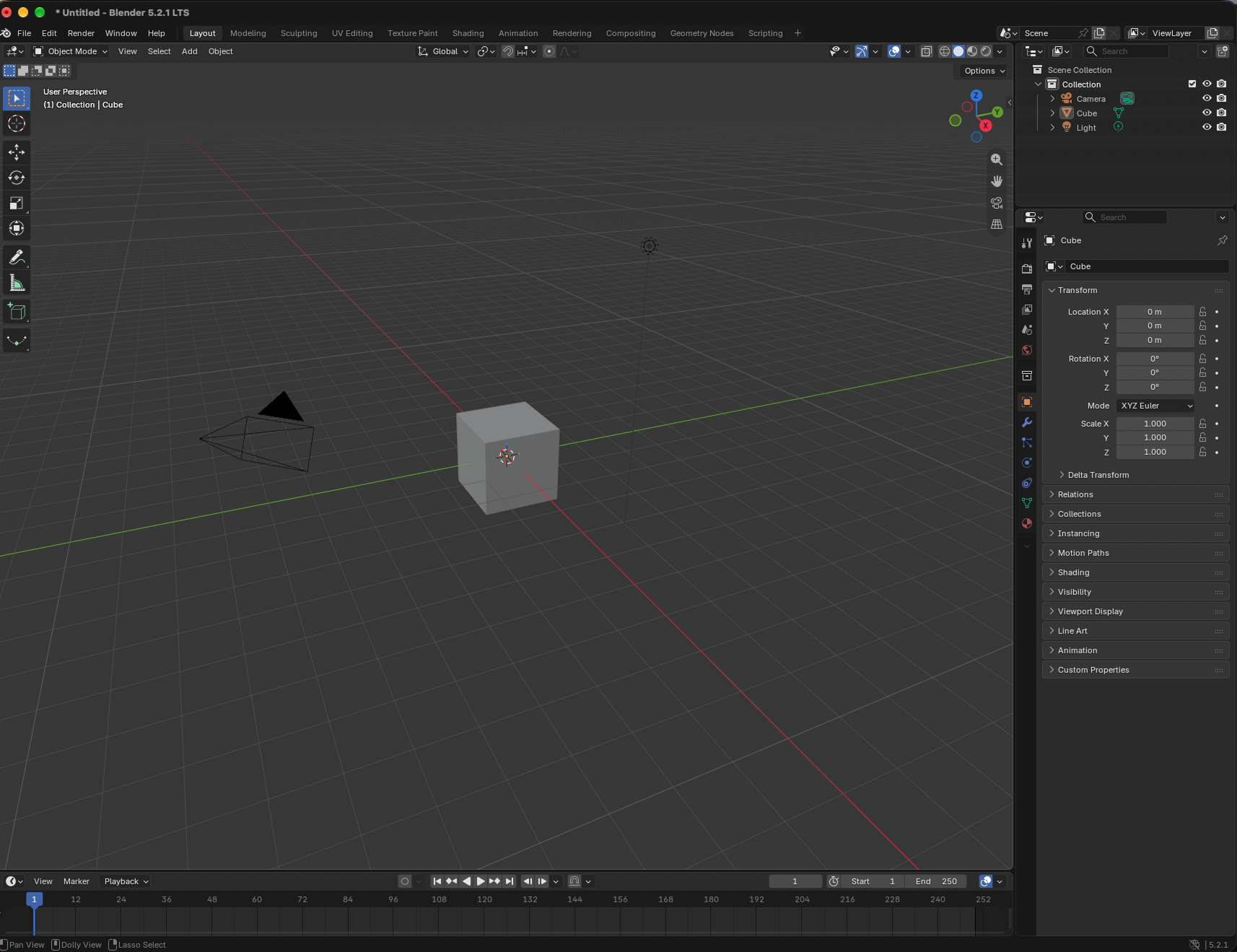 Blender 5.2.1 LTS default scene with a selected gray cube, camera, and light
